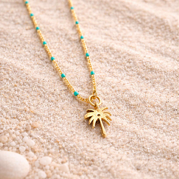 Halsketting turqouise parels met hanger palmboom