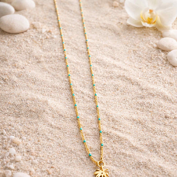 Halsketting turqouise parels met hanger palmboom