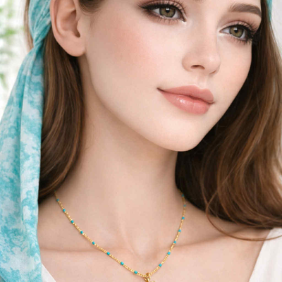 Halsketting turqouise parels met hanger palmboom